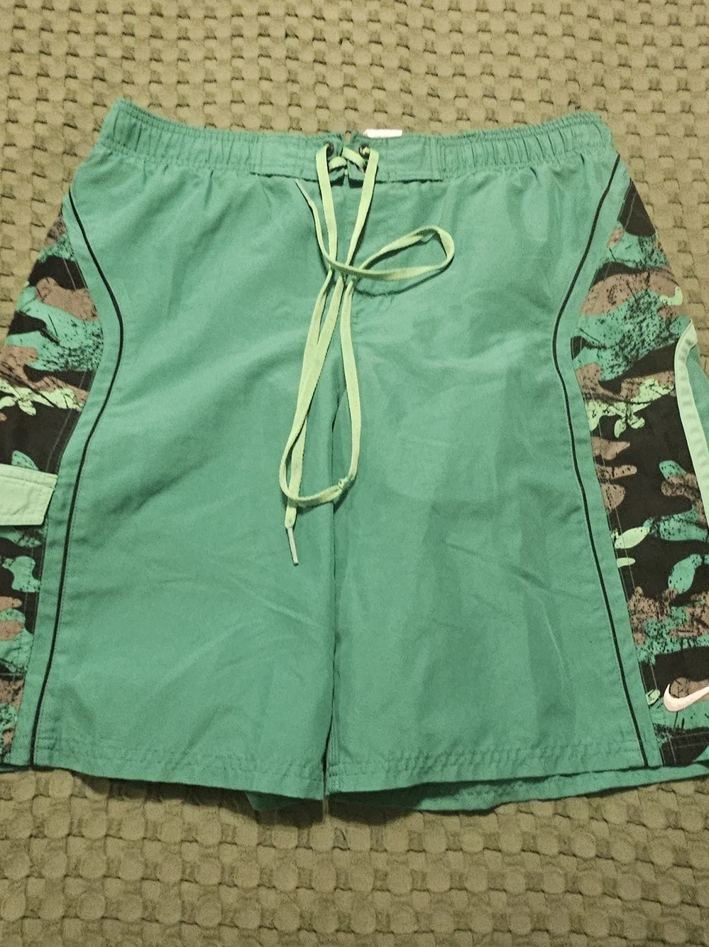 Nike Green Athletic Shorts with White Logo Tag